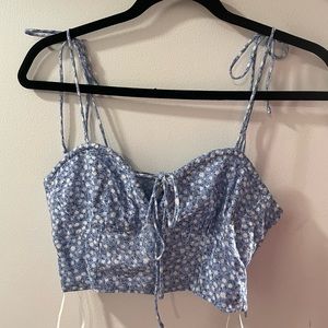 Blue and white floral princess polly cropped tank top.